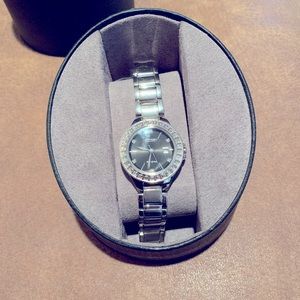 A woman’s citizen watch with diamond accents.